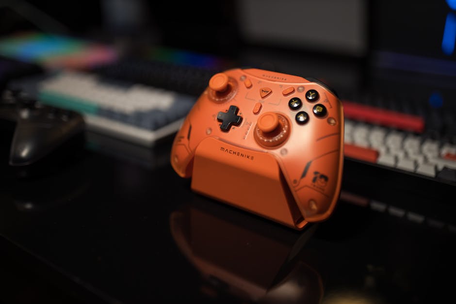 Orange gaming controller on desk with blurred background, ideal for tech enthusiasts. – affordable arc raiders pc