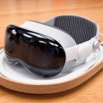 A sleek and modern virtual reality headset on a wooden surface. – Apple AI-Powered Glasses price