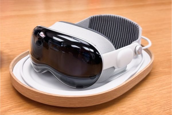 A sleek and modern virtual reality headset on a wooden surface. – Apple AI-Powered Glasses price
