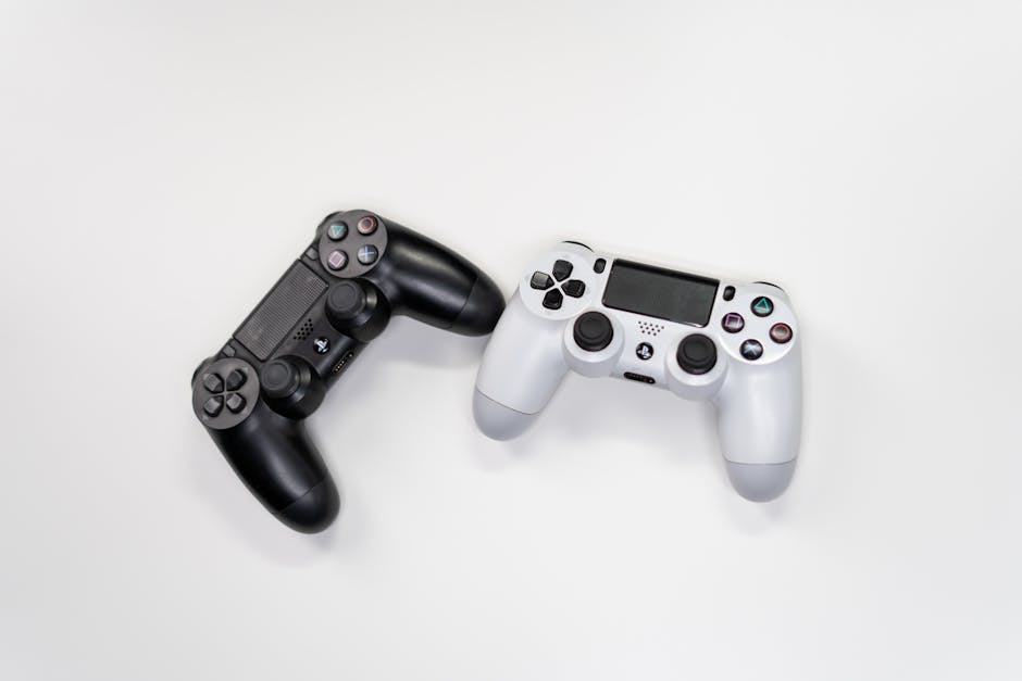Flat lay of black and white gaming controllers against a white backdrop, perfect for gaming enthusiasts. – Assassin's Creed: Black Flag Resynced