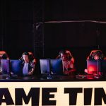 A group of diverse gamers participating in an online eSports tournament indoors. – Beezare Alphas Explained