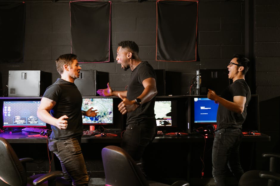 Enthusiastic group of diverse friends celebrating a gaming victory in an esports setting.