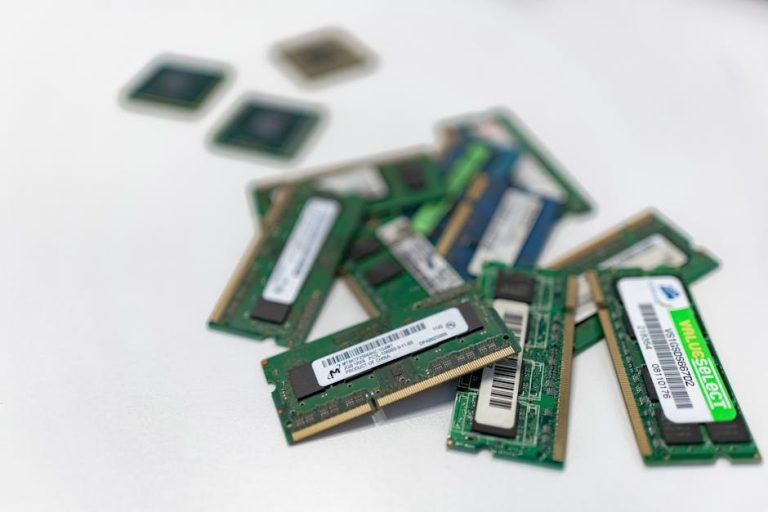 Assorted RAM modules scattered on a white surface, showcasing technology components. – best gpu upgrades 2026