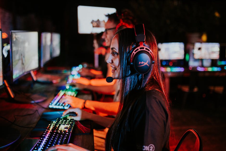 People enjoying a late-night video gaming session with headsets and RGB keyboards. – best monitor for competitive