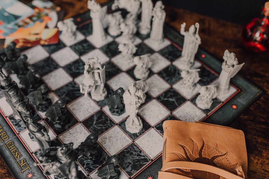 Close-up of a detailed wizard-themed chess set on a wooden table with game card. – Book of Travels price cut