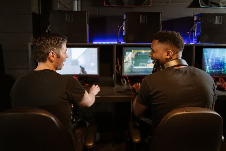 Two men engaged in an exciting gaming session in a modern cyber cafe.