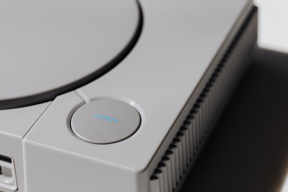 Detailed shot of a classic Sony PlayStation, highlighting the iconic open button and retro design. – console edition vs standard
