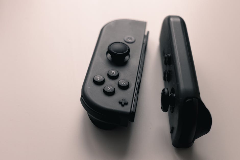 A close-up image of two Nintendo Switch Joy-Con controllers on a neutral background.