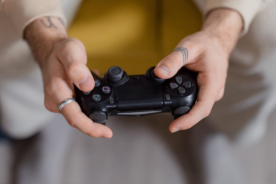 A gamer holding a black game controller, focusing on gaming and entertainment. – best gaming hardware