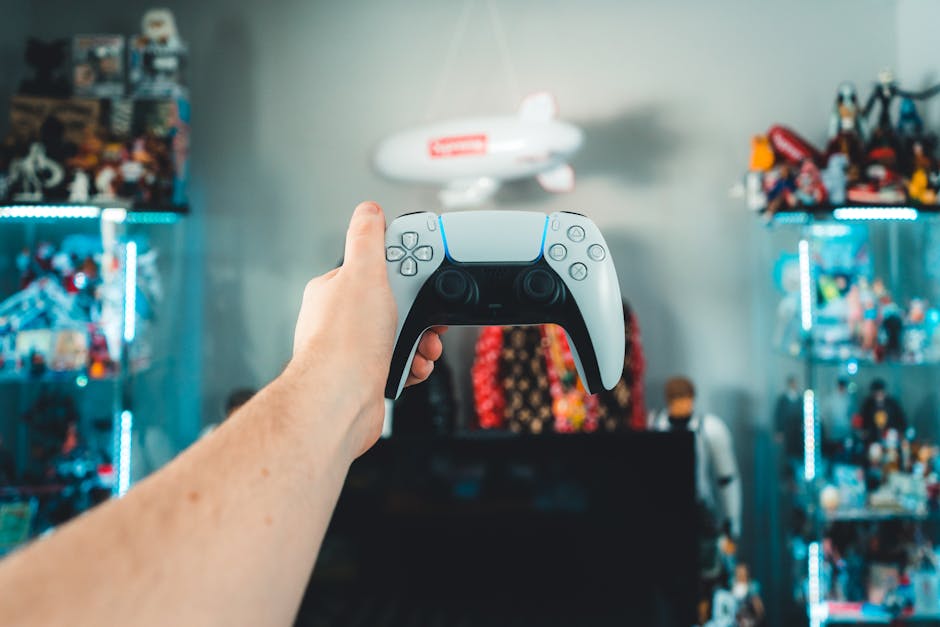 A person holding a gaming controller in a vibrant game room setting.