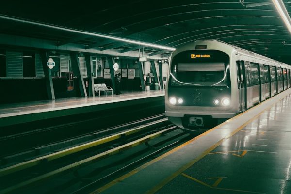 A sleek metro train approaching a station in Bangalore, India at night, showcasing urban transport. – Metro 2039 Reveal Analysis