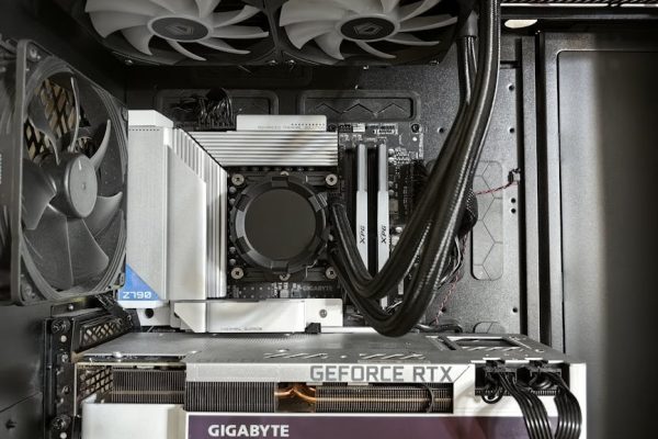 Detailed view of a custom gaming PC's interior showcasing components like RTX GPU and advanced cooling system. – DIY PC hardware for beginners