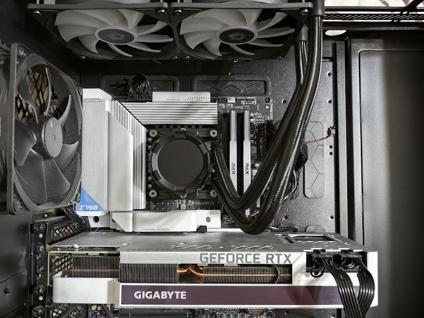 Detailed view of a custom gaming PC's interior showcasing components like RTX GPU and advanced cooling system. – DIY PC hardware for beginners