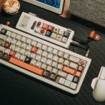 Custom mechanical keyboard and mouse setup on a wooden desk with a retro aesthetic. – Neo75 Cu keyboard review