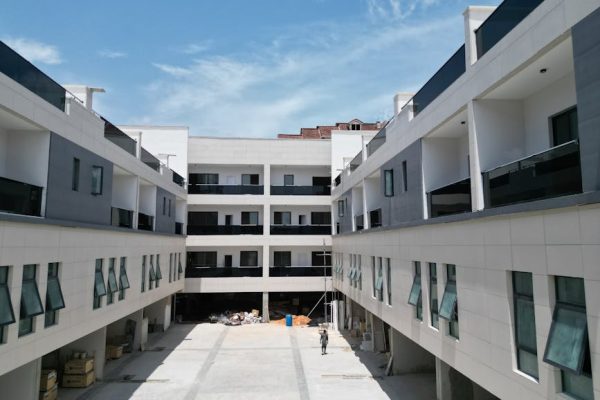 Daytime view of a modern apartment complex under construction, showcasing sleek design and architecture in Lagos, Nigeria. – Nut65 New Build