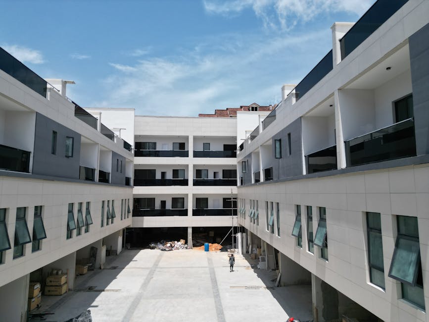 Daytime view of a modern apartment complex under construction, showcasing sleek design and architecture in Lagos, Nigeria. – Nut65 New Build
