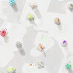 A vibrant 3D render of geometric shapes scattered over a circuit-like background. – Nvidia RTX Neural Texture