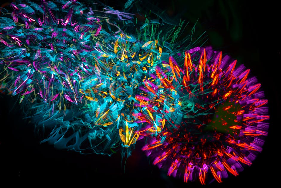 Colorful abstract light patterns with vibrant neon hues on a black background. – Pulsar X2N Crazylight Mini Gaming Mouse Review