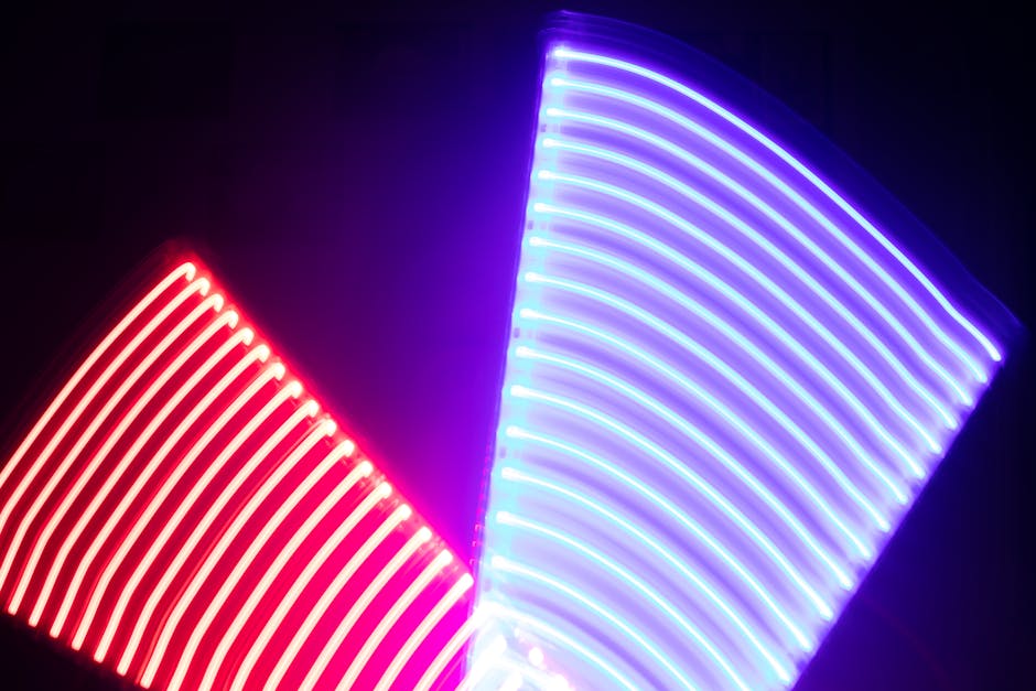 Abstract image of neon light trails with vivid colors and pattern.