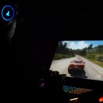 A gamer using a laptop and headphones to play a car racing game in a dark setting. – Replaced Steam Release