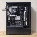 Interior view of a custom-built gaming PC showing components like GPU and cooling system.