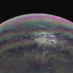 Vibrant macro image capturing the swirling colors and patterns of a soap bubble. – AI bubble in the tech industry