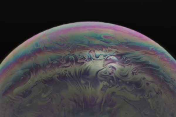 Vibrant macro image capturing the swirling colors and patterns of a soap bubble. – AI bubble in the tech industry