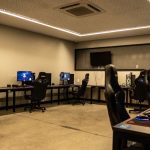 A modern gaming room featuring high-performance PCs, gaming chairs, and sleek design. – trepang2 price drop pc