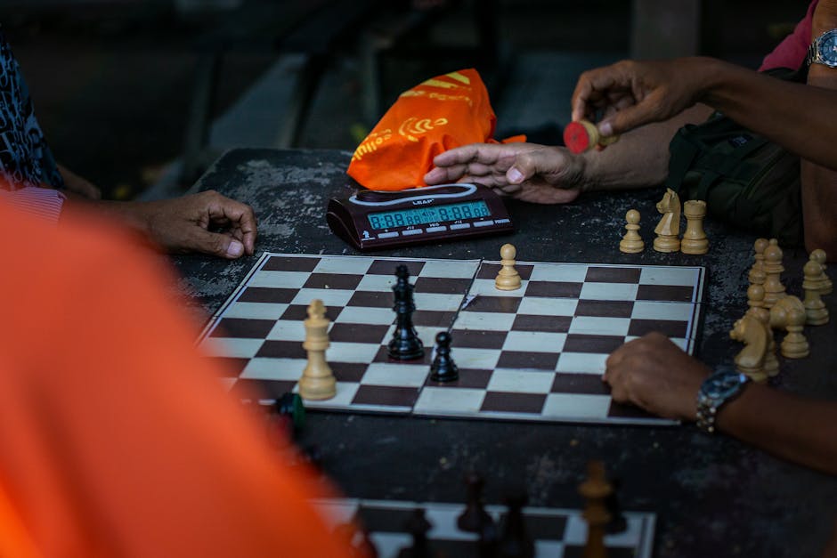 Intense chess game moment captured with players focusing on strategy.