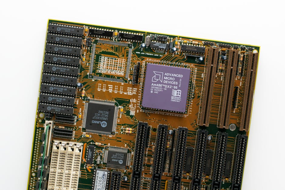 Detailed view of a vintage computer motherboard featuring an AMD processor and electronic components.
