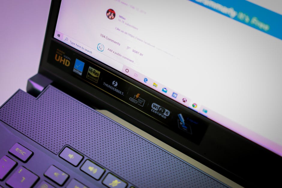 Close-up of an open laptop focusing on screen and keyboard with various icons and text. – 1440p QD-OLED text fringing