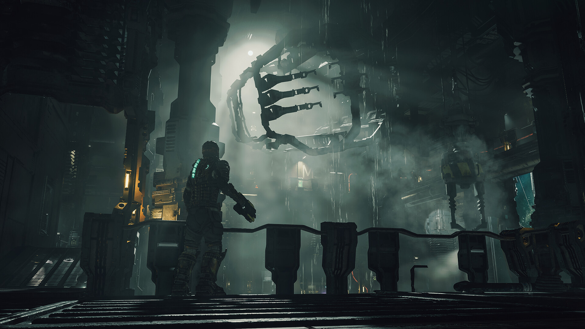 A futuristic, dark industrial setting with a large circular structure and a figure standing in front of it