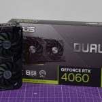 GPU and box on table, both are black and green
