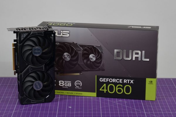 GPU and box on table, both are black and green