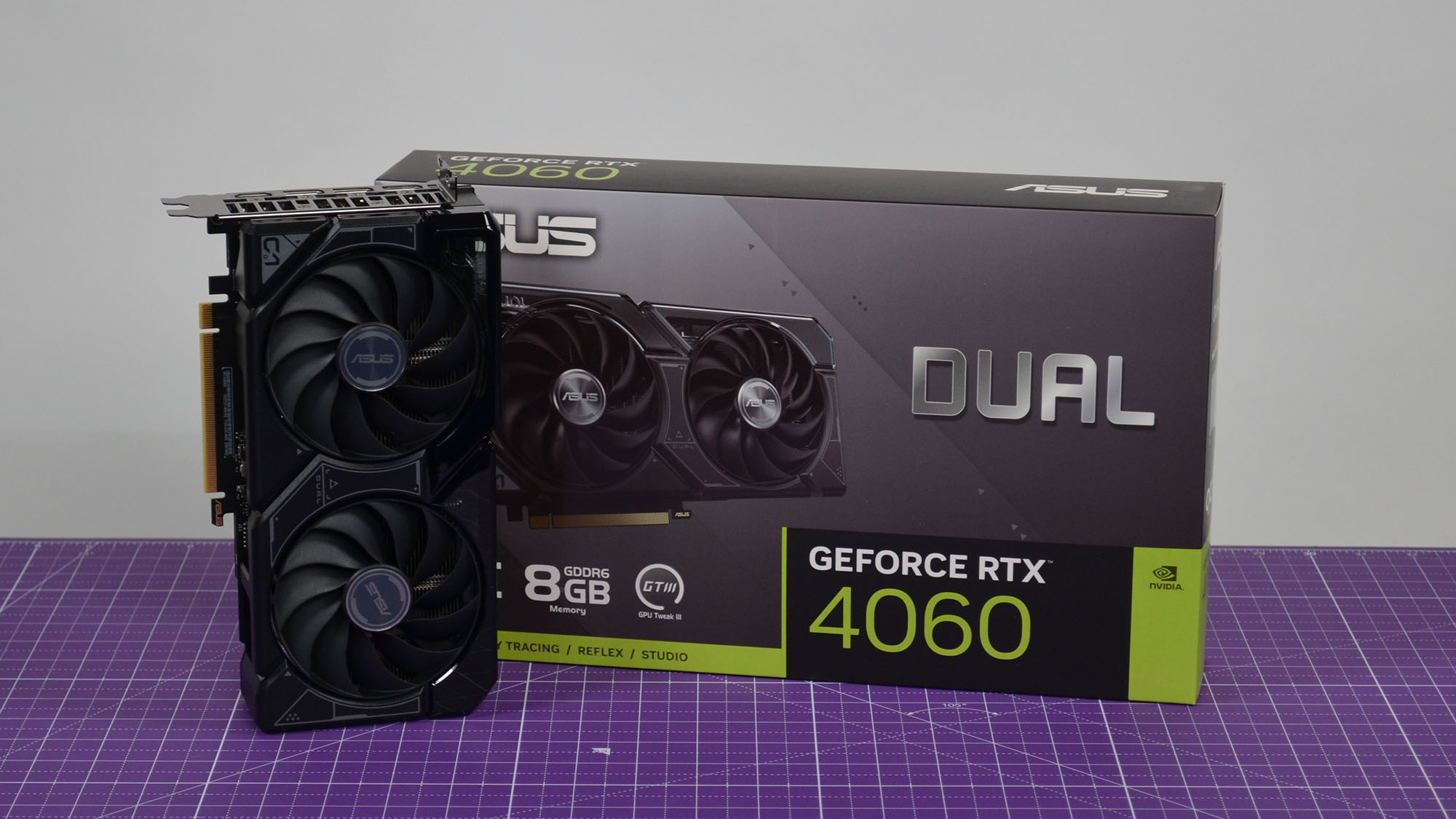 GPU and box on table, both are black and green