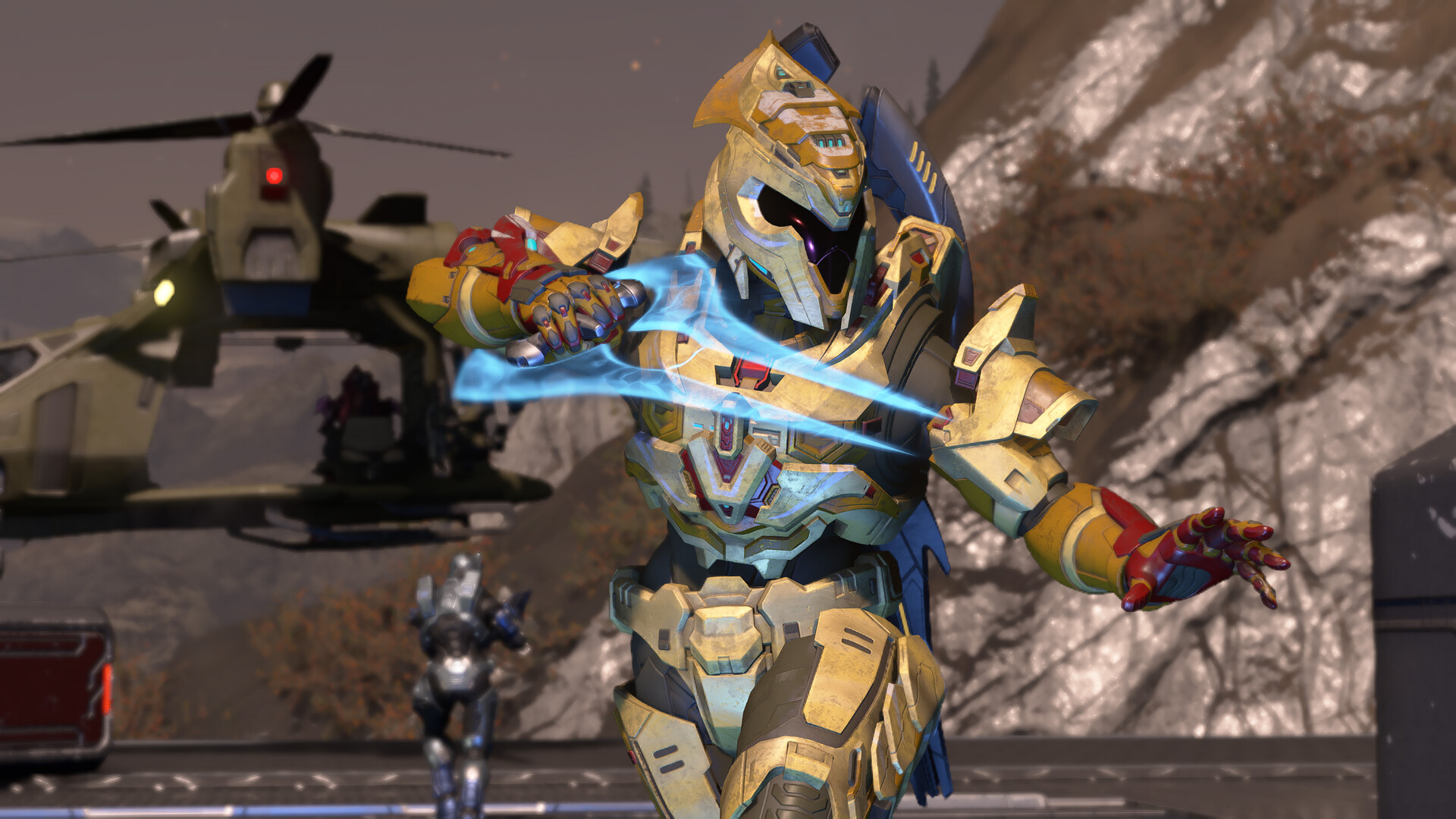 Halo Infinite character in armor, wielding a sword and shield, standing on a rocky terrain with military vehicles in background
